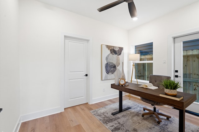 office space featuring light wood-type flooring and ceiling fan