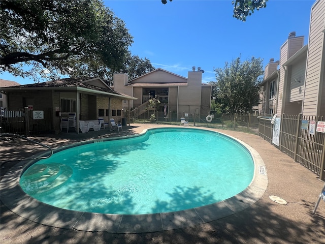 view of pool featuring a patio