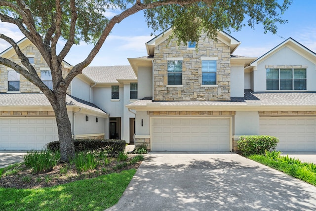 multi unit property featuring a garage