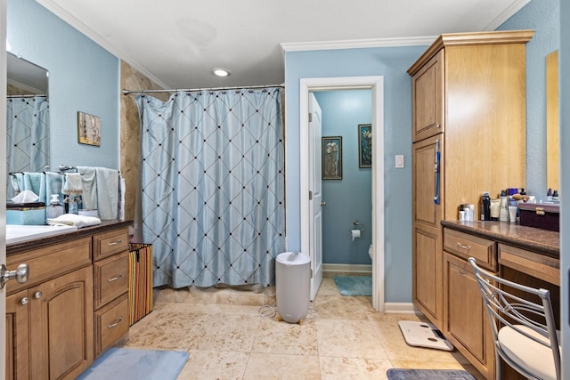 bathroom featuring vanity, curtained shower, ornamental molding, and toilet