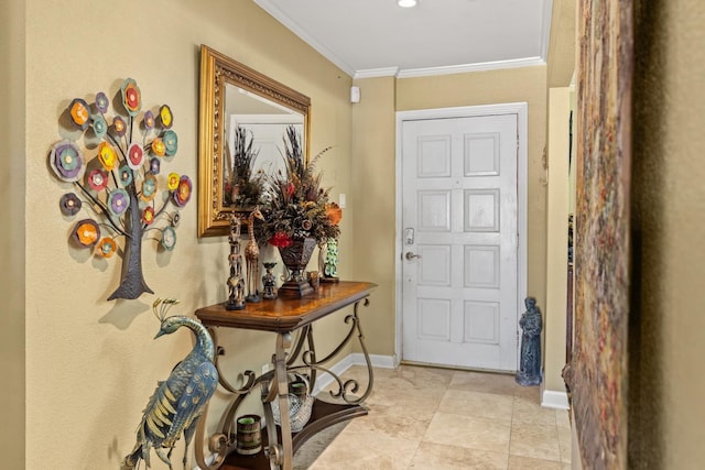 tiled foyer entrance with crown molding