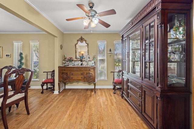 living area featuring ornamental molding, ceiling fan, and light hardwood / wood-style flooring