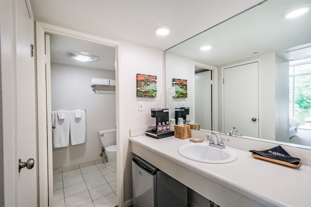 bathroom with tile patterned floors, vanity, and toilet