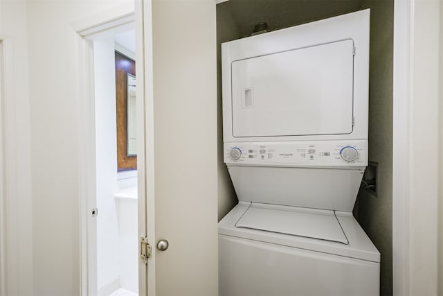 washroom with stacked washer and clothes dryer