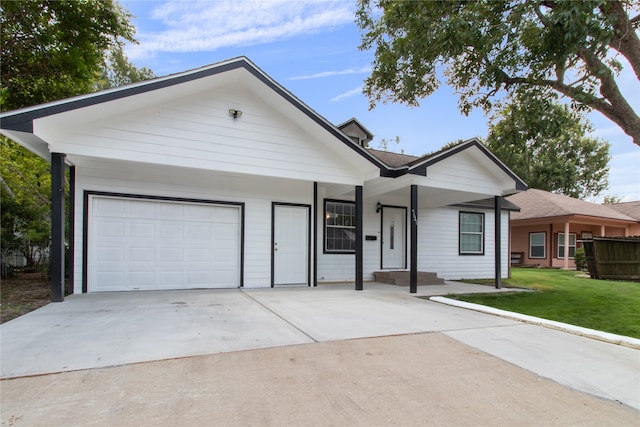 ranch-style home with a garage and a front yard