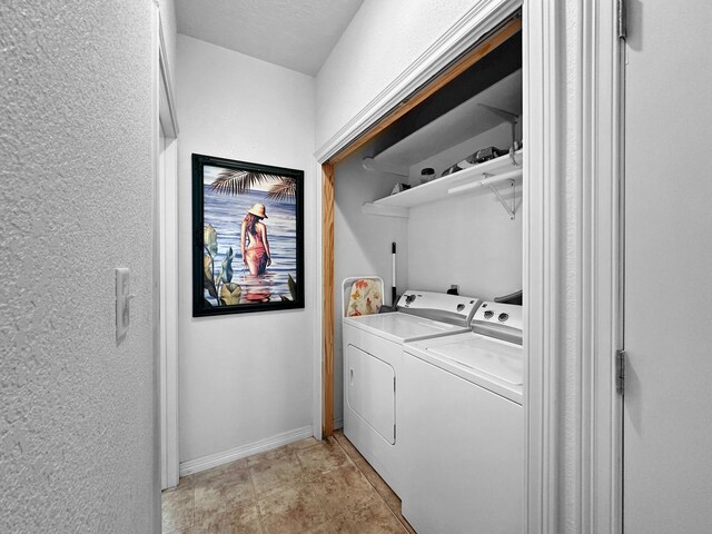 clothes washing area featuring light tile patterned floors and separate washer and dryer