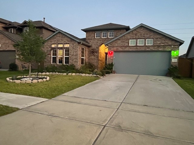 view of front of property featuring a garage and a front yard