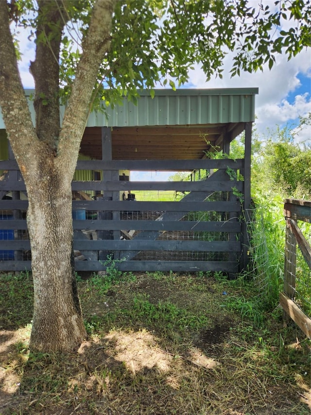 view of gate with an outdoor structure