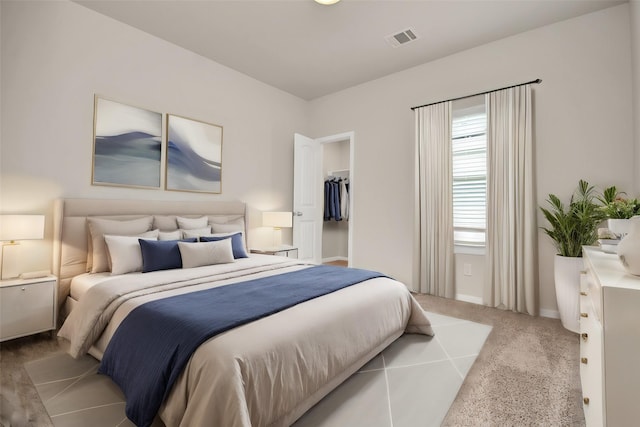 bedroom with light carpet and visible vents