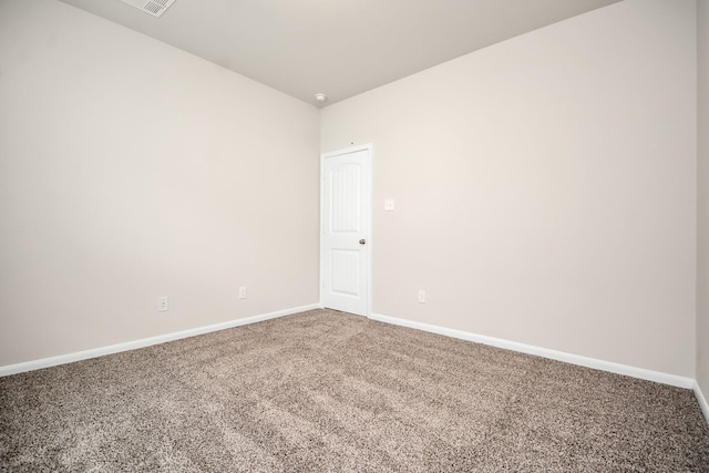 spare room with carpet flooring and baseboards