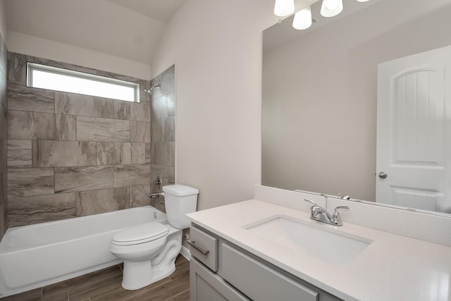 full bath with toilet, vanity, wood finished floors, and shower / bathing tub combination