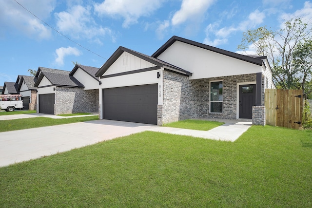 view of front of property with a front lawn and a garage