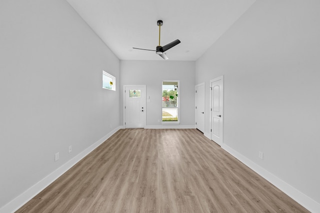 interior space with ceiling fan and light hardwood / wood-style floors