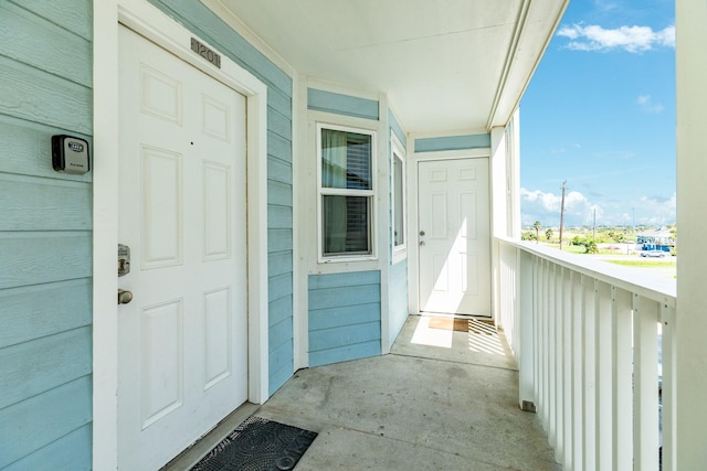 entrance to property with a balcony