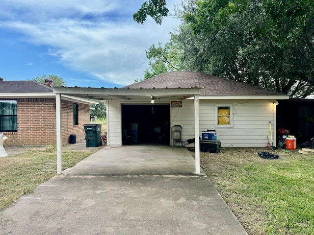 view of front of property featuring a garage and a front lawn