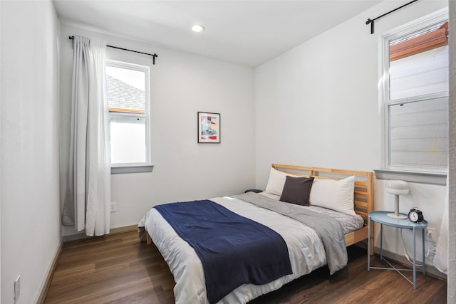 bedroom featuring dark wood-type flooring