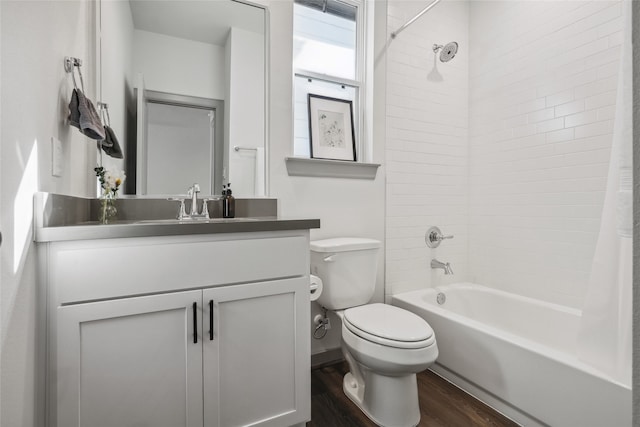 full bathroom featuring shower / bath combo with shower curtain, toilet, vanity, and wood-type flooring