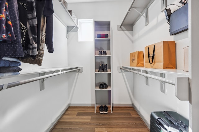 walk in closet featuring dark hardwood / wood-style flooring