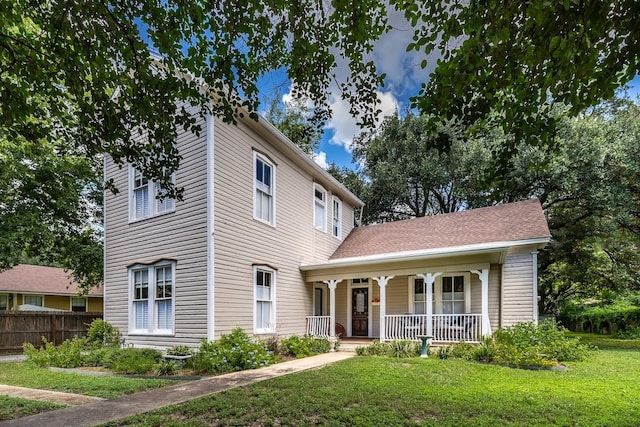 view of front of home with a front lawn and covered porch