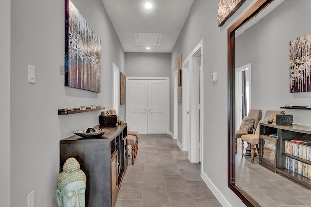 hallway featuring light tile patterned floors