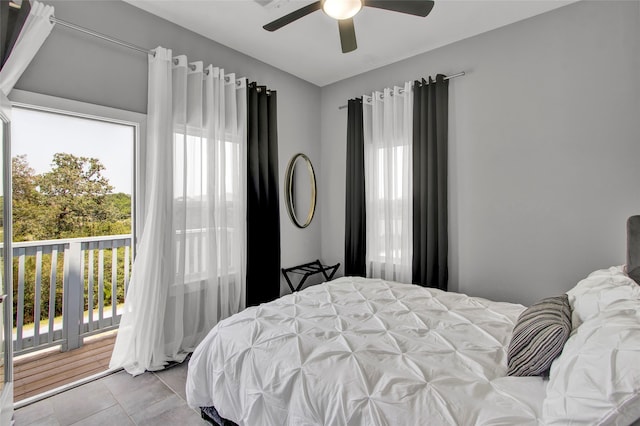 bedroom with ceiling fan and light tile patterned floors