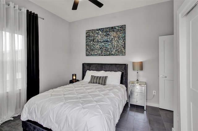 tiled bedroom with ceiling fan