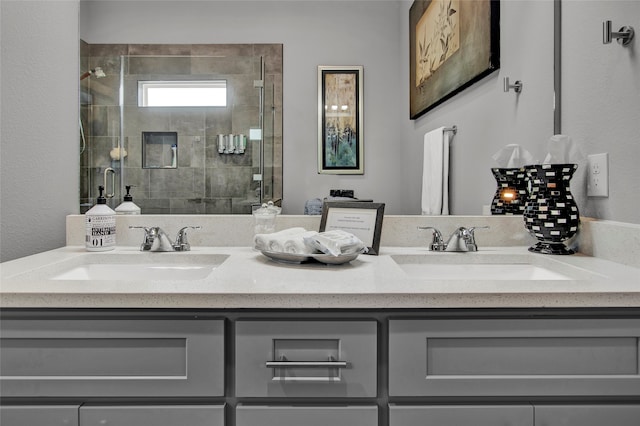 bathroom featuring vanity and a shower with door