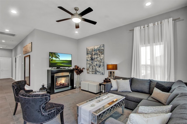 tiled living room featuring ceiling fan