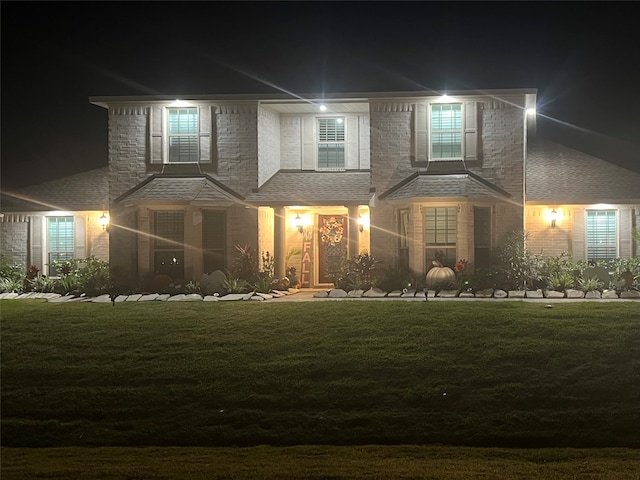 view of front of home with a lawn