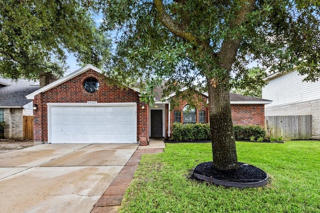 view of front facade with a garage and a front lawn