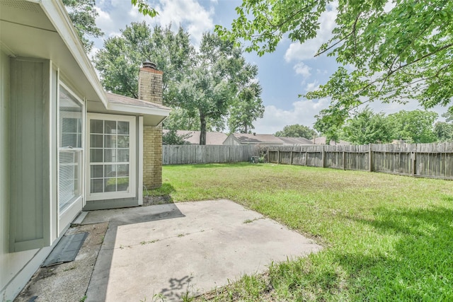 view of yard with a patio area and a fenced backyard