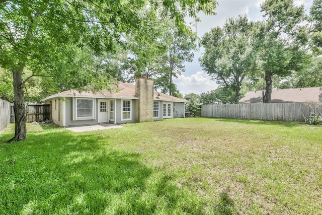 view of yard featuring a fenced backyard and a patio