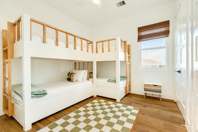 unfurnished bedroom featuring ceiling fan and light hardwood / wood-style flooring