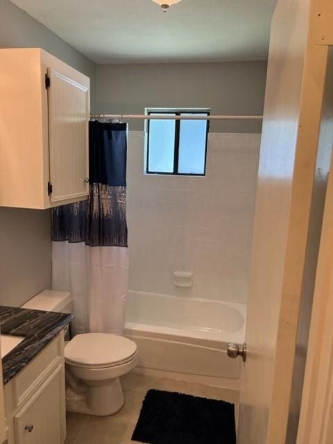 full bathroom featuring shower / bath combo, vanity, and toilet