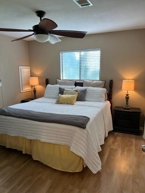 bedroom featuring ceiling fan and wood-type flooring