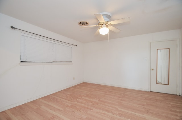 spare room with light hardwood / wood-style flooring and ceiling fan