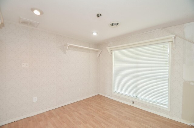 unfurnished room featuring wood-type flooring