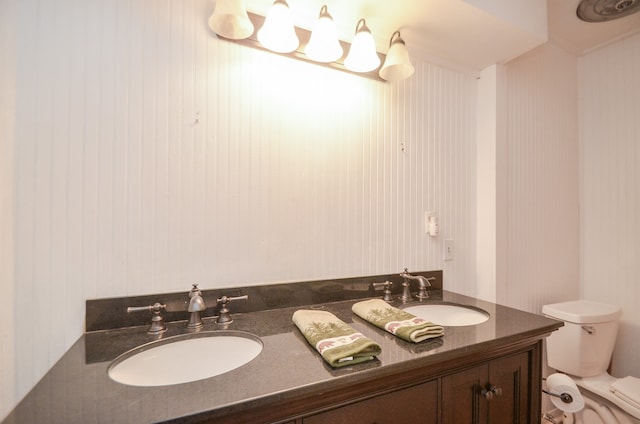 bathroom with toilet and vanity