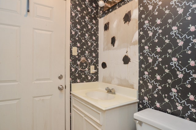 bathroom with vanity and toilet