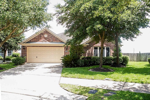 view of front of house with a garage and a front yard