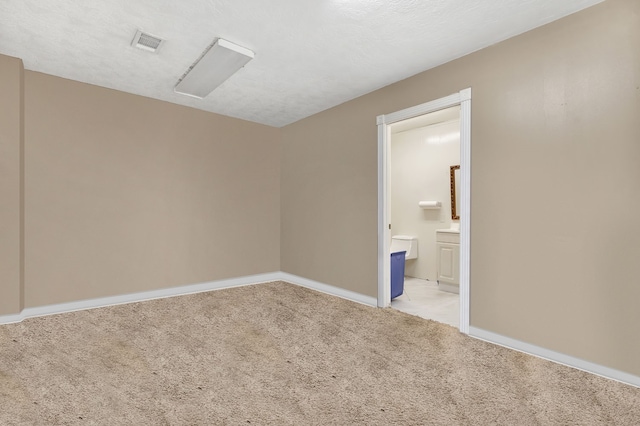 unfurnished room with light colored carpet