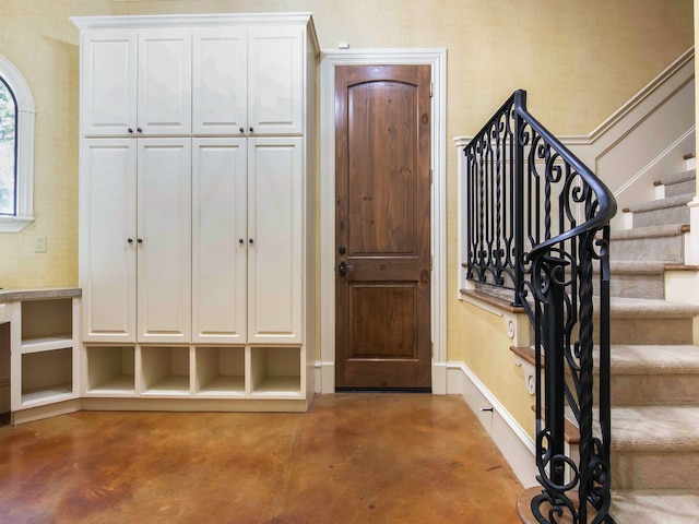 entryway with concrete floors