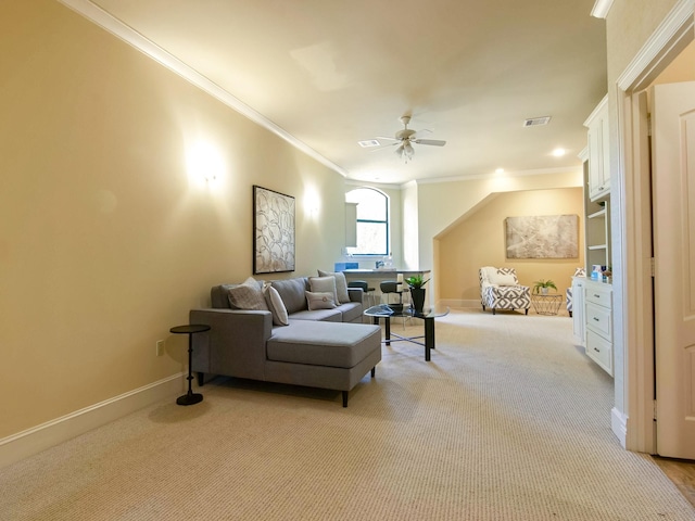 living room featuring baseboards, crown molding, visible vents, and light colored carpet