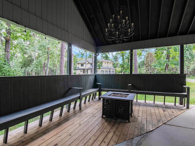 wooden deck with a fire pit