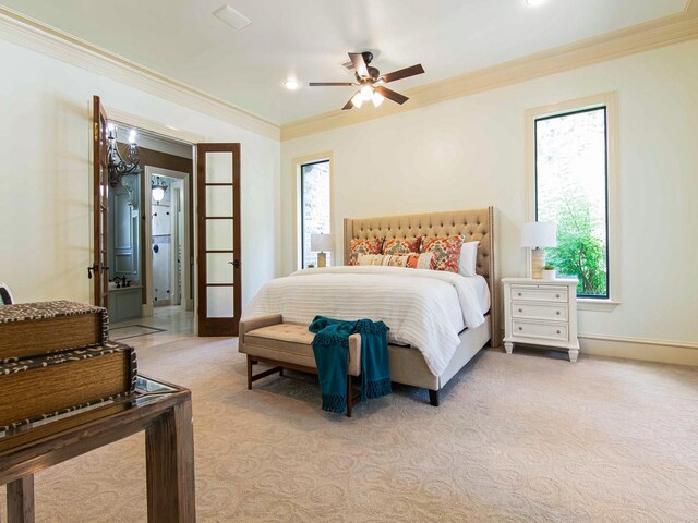 carpeted bedroom with crown molding and ceiling fan