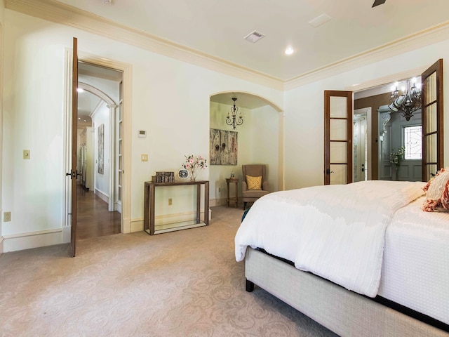 carpeted bedroom with ornamental molding and ceiling fan with notable chandelier