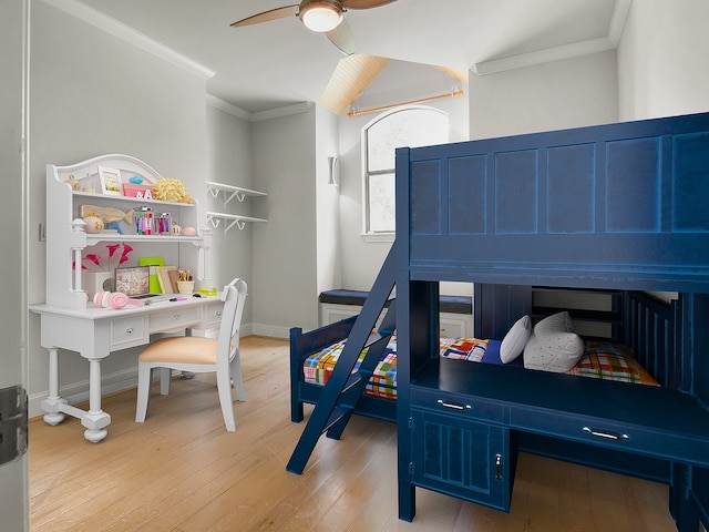 bedroom featuring ceiling fan, light hardwood / wood-style floors, and ornamental molding