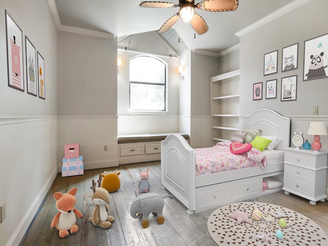 bedroom featuring crown molding, ceiling fan, and wood-type flooring