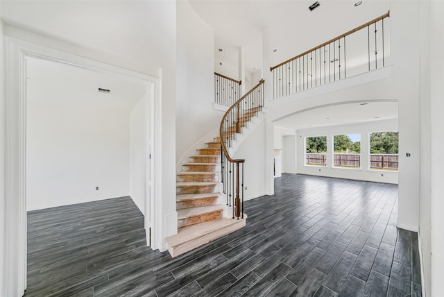 16518 Boston Post Rd, Cypress, TX 77429 - stairway featuring a towering ceiling and wood finished floors