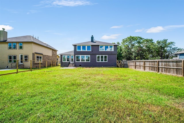 16518 Boston Post Rd, Cypress, TX 77429 - rear view of property featuring a fenced backyard, a chimney, and stairs